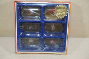 lot 210 image: Vintage Sears Exclusive Pokemon Gold Dog Tags