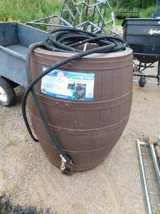 lot 27 image: 50 gallon Flat Back  Whiskey Rain water barrel. --with planter on top