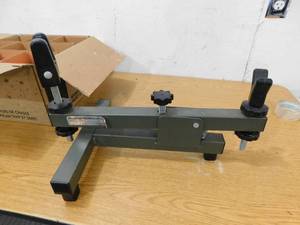 lot 62 image: Rifle Rest for Shooting and Sighting & Box of clay pigeons