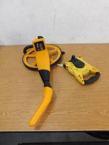 lot 67 image: Measuring Wheel & Stanley 100 Tape Measure