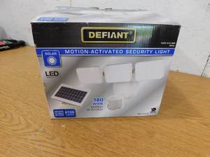 lot 87 image: NEW - Defiant 180° 3-Head White Solar Powered Motion Outdoor Integrated LED Flood Light