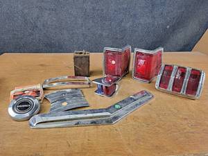 lot 1049 image: Lot of Vintage Auto Parts  Trim - Some are Labeled - Taillights for 68-72 El Camino, Trim for 62-63 Ford Falcon, Trims for 1950 Pontiac Silver Streak and More