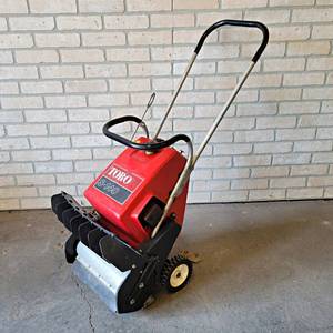 lot 1063 image: TORO S-140 Gas Snow Sweeper - Runs but leaks gas from carburetor - NO SHIPPING
