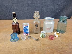 lot 1106 image: Marigold Dairy Bottle, Occupied Japan Figure, Cream Top Spoon, Redwing Stoneware Crock, and More