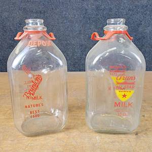 lot 1141 image: Pair of Vintage Milk Bottles - Brantons Hygienic Dairy and Greens All Star Dairy