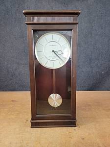 lot 1180 image: Beautiful Howard Miller 83rd Anniversary Edition Clock - Tested and Works - Includes batteries - Overall about 25 x 10.5 x 5