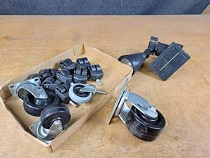 lot 1209 image: Outdoor Solar Flood Light and Assorted Caster Wheels