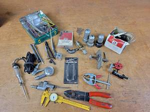 lot 1263 image: Air Chucks, Tire Pressure Gauges, Wire Stripper, 12V Tester, Battery Post Cleaners and More