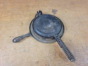 lot 1311 image: GRISWOLD No. 8 Cast Iron Waffle Iron, Patent Date 1908