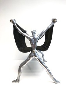 lot 8 image: Quality Designer Black Leather & Chrome Figural Magazine or Firewood Holder by Carrol Boyes