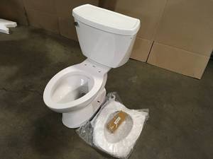 lot 36 image: American Standard Cadet 2-Piece 1.6 GPF Tall Height Pressure-Assisted Elongated Toilet in White, Seat Not Included Customer Returns See Terms on Auction