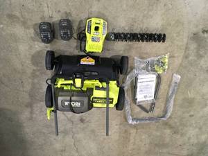 lot 37 image: RYOBI ONE HP 18V Brushless 14 in. Cordless Battery DethatcherAerator with (2) 4.0 Ah Batteries and Charger Customer Returns See Terms on Auction