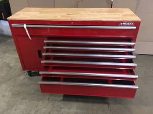 Husky 61 in. W x 22.1 in D Standard Duty 7-Drawer 1-Door Mobile Workbench Tool Chest with Solid Wood Top in Gloss Red Customer Returns See Terms on Auction