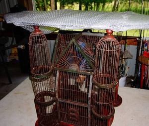 Unique birdcage based endtable 28 inches tall with 2 x 3 Removal oval glass top