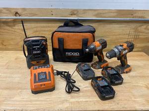 lot 21 image: RIDGID 18V Cordless 3-Tool Combo Kit with 12 in. DrillDriver, 14 in. Impact Driver, Radio, 3 Batteries, Charger and Bag
