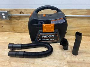 lot 94 image: RIDGID 3 Gal. 18-Volt Cordless Handheld WetDry Shop Vacuum (Tool Only) with Filter, Expandable Hose and Accessories (non-working)