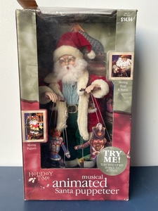 lot 104 image: Musical Animated Santa Puppeteer