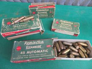 1 PARTIAL BOX OF VINTAGE REMINGTON 45S PLUS EMPTY BOXES AND SOME BRASS