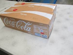 lot 75 image: 2- 12 pks 12 oz Cans Vanilla Coke...