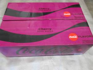 lot 96 image: 2- 12 pks 12 oz Cans Cherry CocaCol...