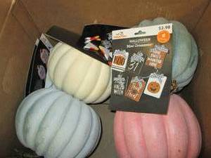 box of pumpkins and halloween ornam...