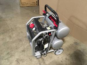 lot 11 image: Husky 4.5 Gal. Portable Electric-Powered Silent Air Compressor Customer Returns See Terms on Auction