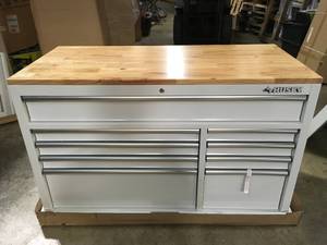 lot 23 image: Husky 52 in. W x 24.5 in. D 9-Drawer Standard Duty Mobile Workbench Tool Chest with Solid Work Top and Pegboard in Gloss White Customer Returns See Terms on Auction