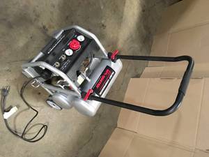 lot 40 image: Husky 4.5 Gal. Portable Electric-Powered Silent Air Compressor Customer Returns See Terms on Auction