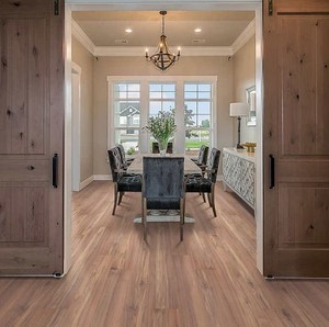 lot 486 image: Roughly 195 sq ft (12 boxes) of Mohawk Home Clay Canyon Teak Waterproof Laminate 12mm Thick Plank With 2mm Attached Pad Included