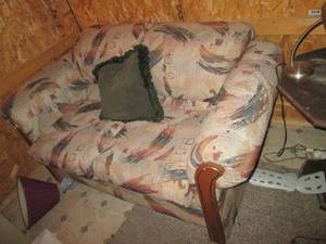 Loveseat with wood trim...