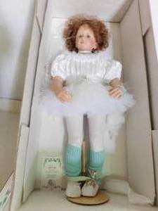 lot 22 image: The great american doll company porcelain doll with cloth body limited edition - Trixie