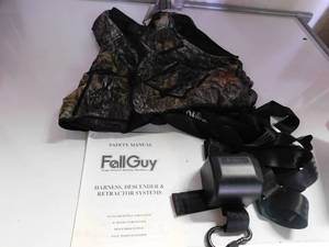 lot 61 image: Fall guy tree stand safety system harness, descender and retractor system
