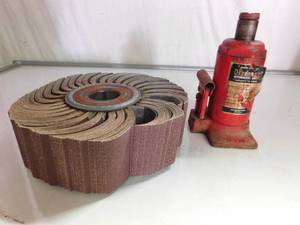 lot 94 image: Industrial sanding wheel and hydrolic jack