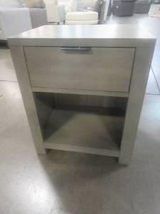 lot 131 image: CREATED FOR MACYs HOME MERIDIAN FURNITURE Solid Wood Nightstand With Single Drawer With Cubby Hole For Additional Storage. Approximate Dimensions 20 x 16 x 24 Tall. In Like New Condition.