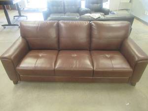 lot 152 image: CREATED FOR MACYs VIOLINO FURNITURE, Leather Sofa in Brown. Approximate Dimensions 83 x 36 x 35 Tall.