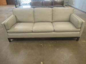 lot 154 image: CREATED FOR MACYs VIOLINO FURNITURE, Leather Sofa in Light Beige. Approximate Dimensions 86 x 36 x 35 Tall.