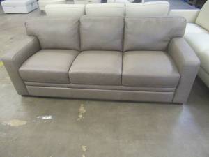 lot 155 image: CREATED FOR MACYs CHATEAU DAX FURNITURE, Leather Sofa in Beige. Approximate Dimensions 86 x 36 x 33 Tall.