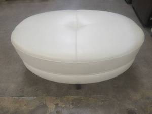 lot 159 image: CREATED FOR MACYs VIOLINO FURNITURE, Leather Ottoman in Off-White. Approximate Dimensions 42 x 27 x 18 Tall.