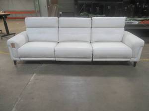 lot 166 image: CREATED FOR MACYs JASON FURNITURE,  Powered Leather Reclining 3-Sectional Sofa in White. Approximate Dimensions 112 x 36 x 38 Tall.