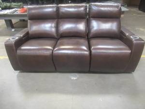 lot 168 image: CREATED FOR MACYs TIMBERLAND FURNITURE, Powered Leather Reclining Sofa in Brown (Cut bare Wire, Small Rip in Arm). Approximate Dimensions 84 x 34 x 36 Tall.