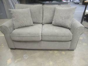 lot 175 image: CREATED FOR MACYs TIMBERLAND FURNITURE, Upholstered Loveseat in Light Brown. Approximate Dimensions 64 x 38 x 30 Tall.
