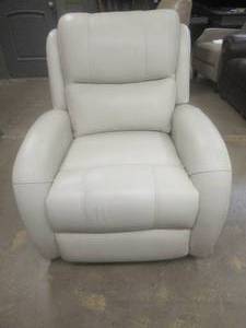 lot 176 image: CREATED FOR MACYs TIMBERLAND FURNITURE, Leather Powered Recliner in Alfresco Ice ( Small Tear in Back of Headrest). Approximate Dimensions 34 x 36 x 40 Tall.