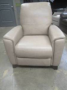 lot 177 image: CREATED FOR MACYs VIOLINO FURNITURE, Leather Manual Recliner in Mink. Approximate Dimensions 34 x 33 x 40 Tall.