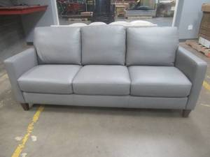 lot 184 image: CREATED FOR MACYs VIOLINO FURNITURE, Leather Sofa in Gray. Approximate Dimensions 80 x 36 x 31 Tall.