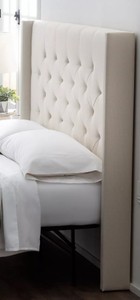 lot 197 image: CREATED FOR MACYs JGW FURNITURE, Tall Upholstered Wingback Headboard Only in Cream. Did Not want to remove completely from packaging to keep clean.  Approximate Dimensions Without Feet 84 X 70 Tall.
