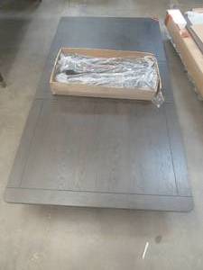 lot 193 image: CREATED FOR MACYs STEVE SILVER FURNITURE, Solid Wooden Dining Table in Mohogany Finish, Has Legs - Missing Hardware. Slight Corner and Edge DingsScratches (see photos). Approximate Dimensions 64 X 42 X 31 Tall. Leaf is 16.