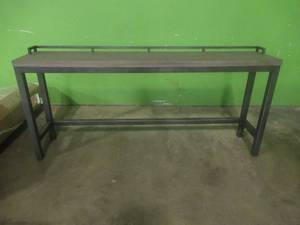 lot 198 image: CREATED FOR MACYs UNIVERSAL FURNITURE, Tall Wood And Metal BuffetBar Table With Rail. Some Scratches on Rail (See Photos). Approximate Dimensions 82 X 16 X 36 Tall.