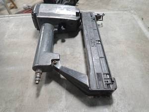 Nail Gun  Brand and model have been worn off  still fully functional  inspection suggested
