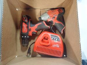 Milwaukee Lot  Includes Battery Charger, Drill and Impact Driver  No Batteries included