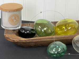 Decorative Wooden Bowl Paired with Candles and Marine Themed Art Glass
